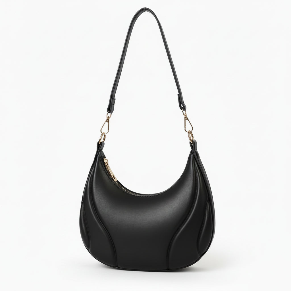 Black handbag with a strap on a white background