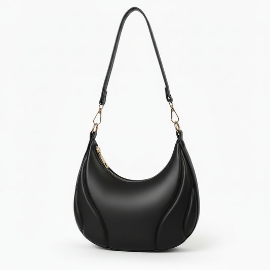Black handbag with a strap on a white background